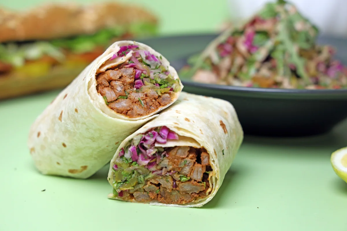 Wholegrain wraps filled with vegetables and a bean-based filling.
